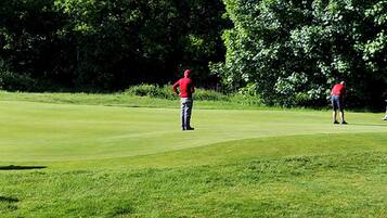 Enjoy a round of golf on our well-maintained fairway surrounded by a lush wooded backdrop.