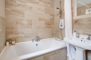 Combined shower/tub, hair dryer, towels, soap