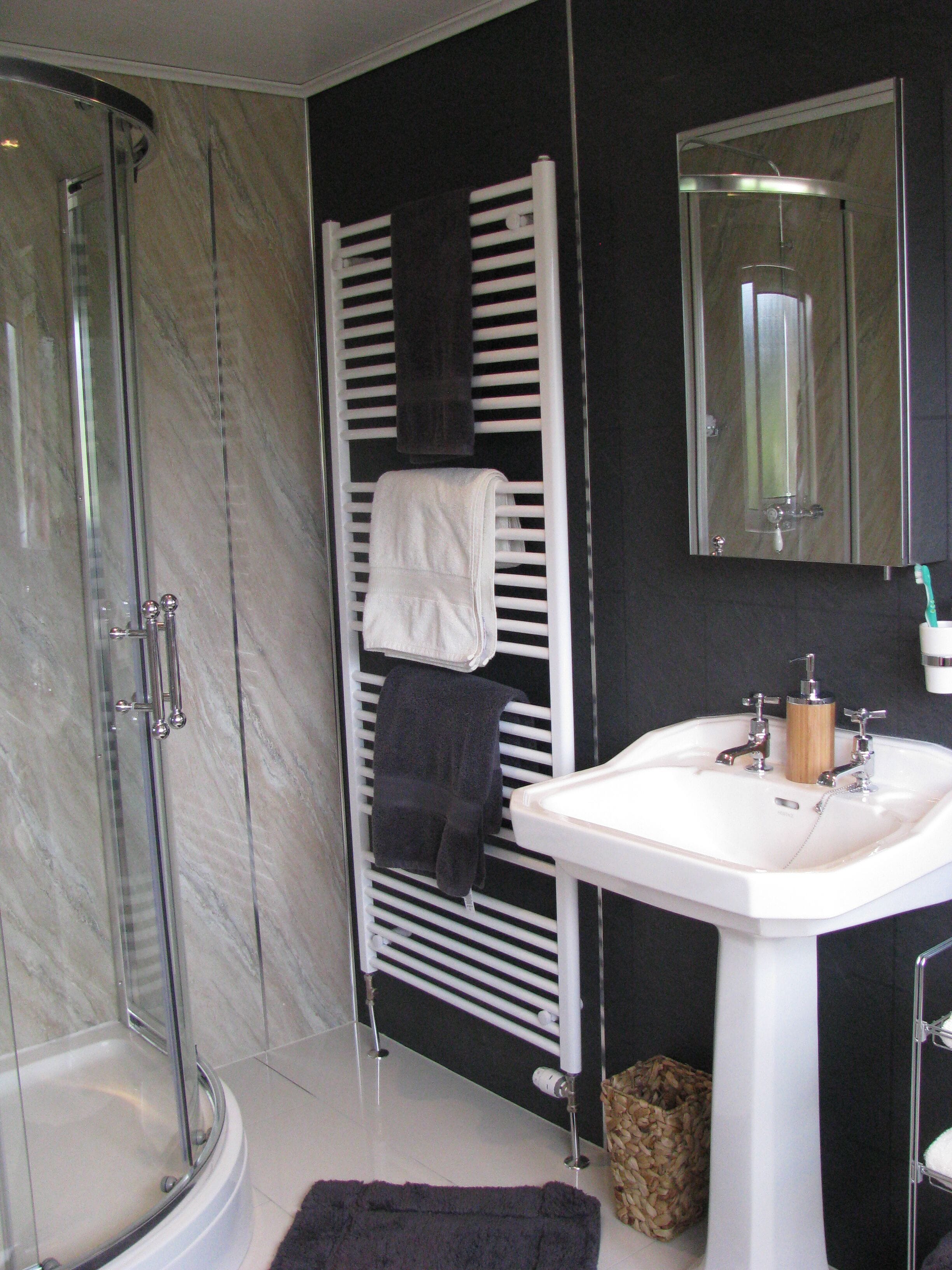 Combined shower/tub, hair dryer, towels, soap