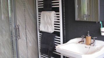Combined shower/tub, hair dryer, towels, soap