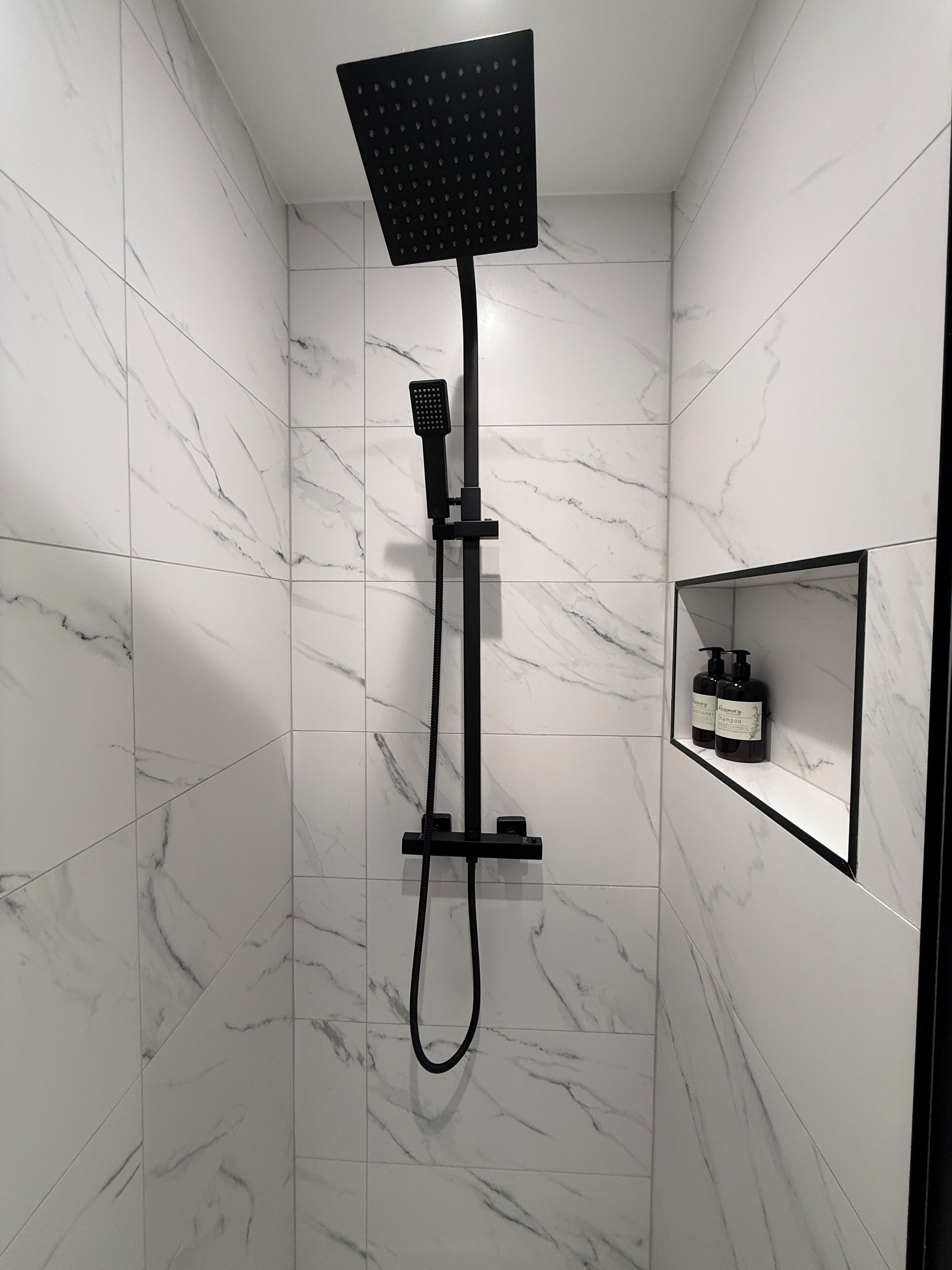 Combined shower/tub, hair dryer, towels, soap