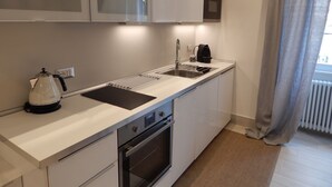 A modern kitchen with a built-in oven, a kettle, and a coffee maker. - 3 beds/3 baths, 3 min. walking to the Vatican Museums, metro station, FREE WIFI (Roma)