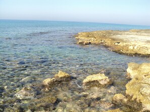On the beach, sun loungers