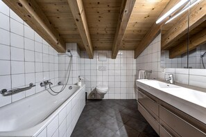 Bathtub, hair dryer, towels