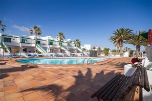 Outdoor pool, a heated pool, sun loungers