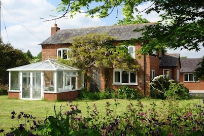 Tranquil country cottage set in the heart of a traditional family farm.