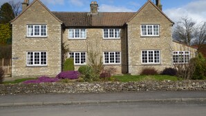 A two-story stone building with multiple windows and a chimney. - Spacious House 3 ensuite bedrooms, sleeps 6, Centre of Helmsley, Pet friendly,  (Helmsley)
