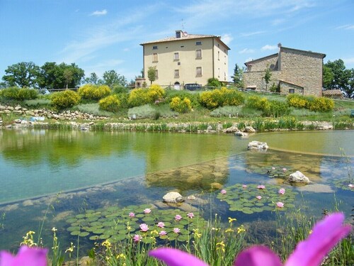 Country farmhouse with large organic swimming-pool and garden