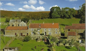 The beautiful setting of Postgate Farm. Postgate Nook is in the barn on the left