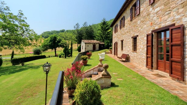 A stone building with a courtyard, a small garden, and a staircase leading to the entrance. - It's pure magic! Dont' miss this unique chance...a beautiful view and an exclusive stay will take yo (Serrapetrona)