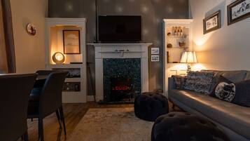 Smart TV, fireplace, DVD player, books