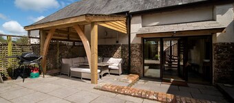 Weirmarsh Big Barn. Large barn conversion with large hot tub and games room.