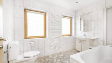 Combined shower/bathtub, hair dryer, towels, soap