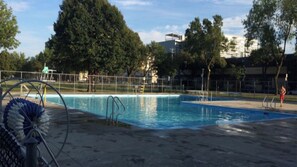 Enjoy a refreshing swim in our outdoor pool surrounded by a park-like setting.