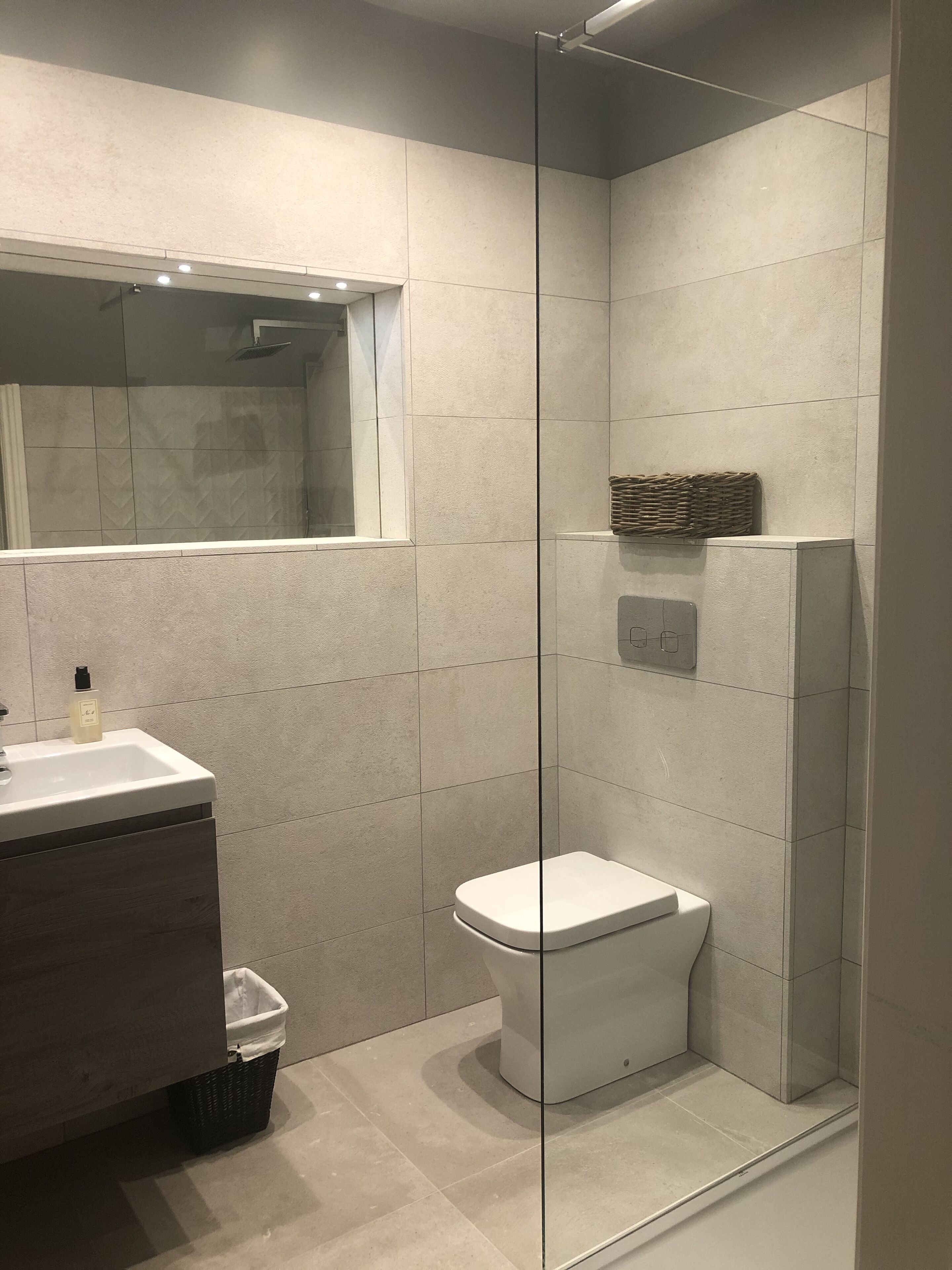 Bathtub, hair dryer, towels, soap