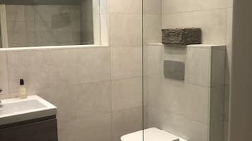 Bathtub, hair dryer, towels, soap