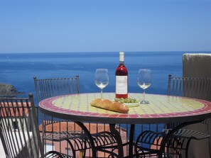 Enjoy a glass of local rose & olives