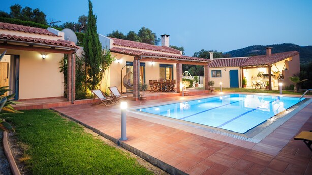 A swimming pool with a tiled deck, outdoor furniture, and a pergola. - Luxurious villa, idyllic view, 5km from town & beach, total privacy, large pool (Rethimno)