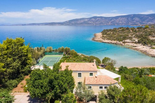 Luxury beachfront villa Aria - pool, tennis, sunset views & seaside adventures.