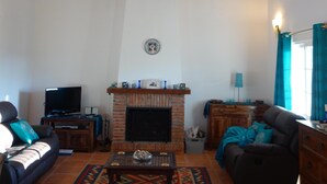A spacious living room with a high wooden ceiling, a fireplace, a television, and comfortable seating. - Finca, Villa, Large HEATED Private Pool fantastic views, secluded near Coin (Coín)