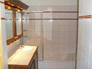 Combined shower/tub, hair dryer, towels, toilet paper
