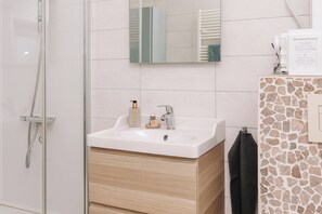 Shower, hair dryer, towels, soap