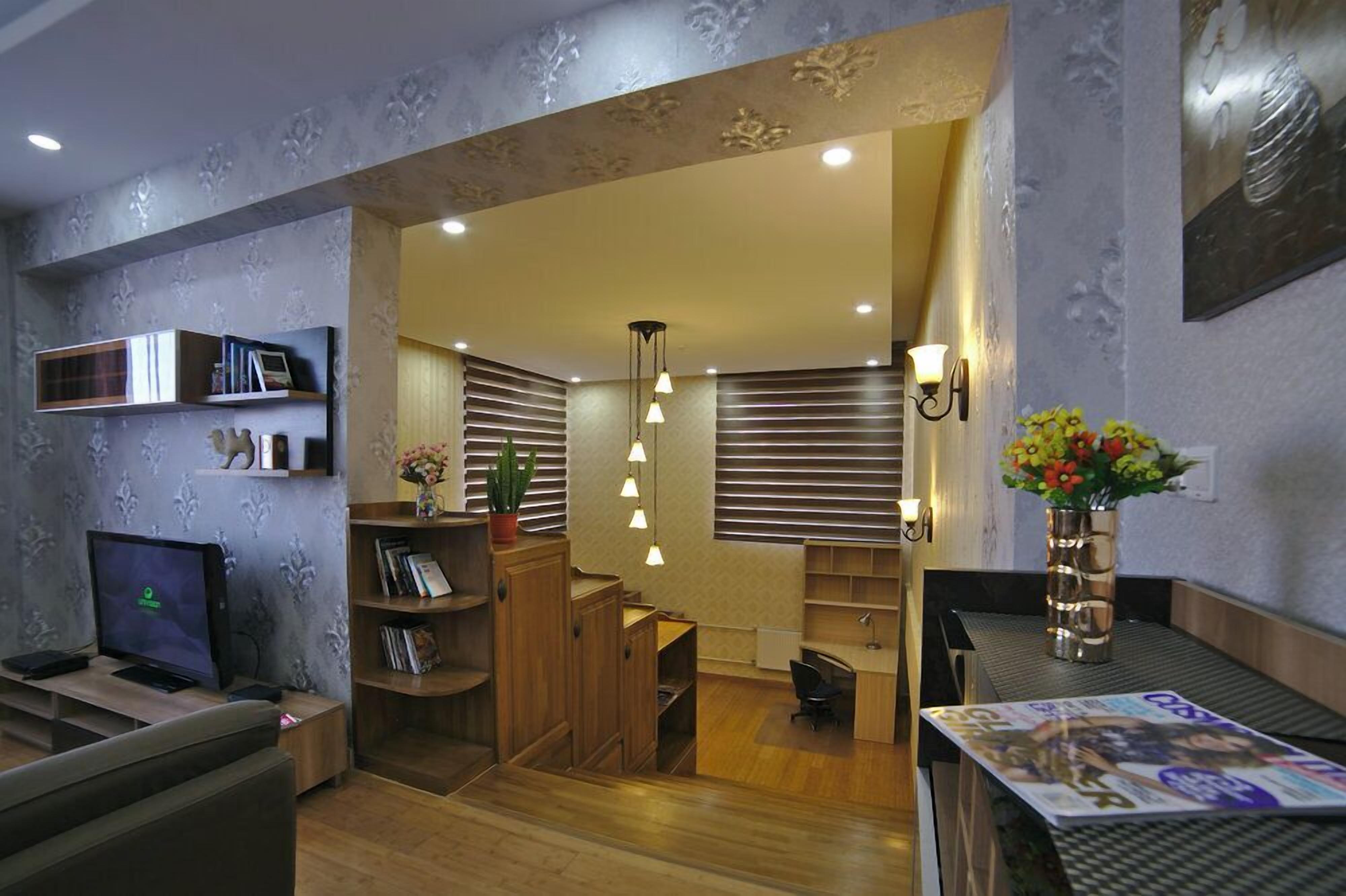 Split Level 1-Bedroom Apartment | Living area | LED TV