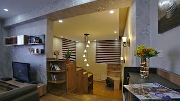 Split Level 1-Bedroom Apartment | Living area | LED TV