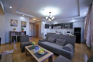 Split Level 1-Bedroom Apartment | Living area | LED TV