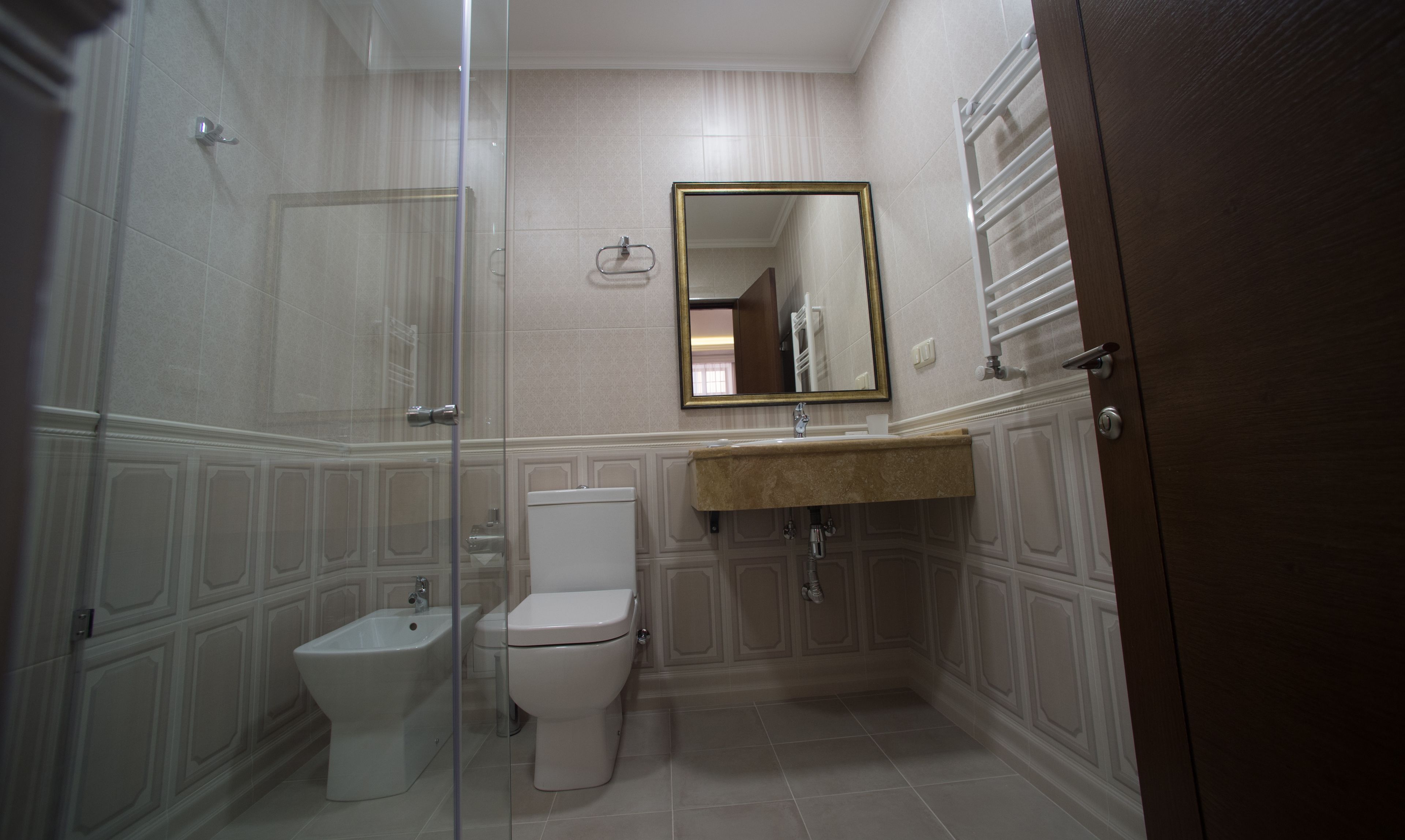 junior suite, garden view | bathroom | shower, free toiletries, hair dryer, bathrobes