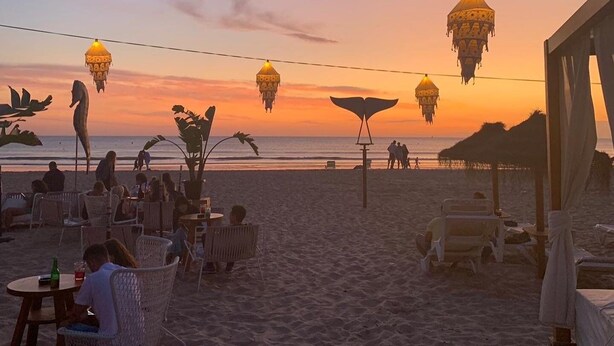 A beachside setting with outdoor seating and hanging lanterns. - Villa Gabriella 4 bed Villa opposite Golf Course,  3km from the beach (Chiclana de la Frontera)
