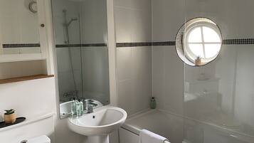 Combined shower/tub, hair dryer, towels, soap