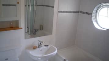 Combined shower/tub, hair dryer, towels, soap