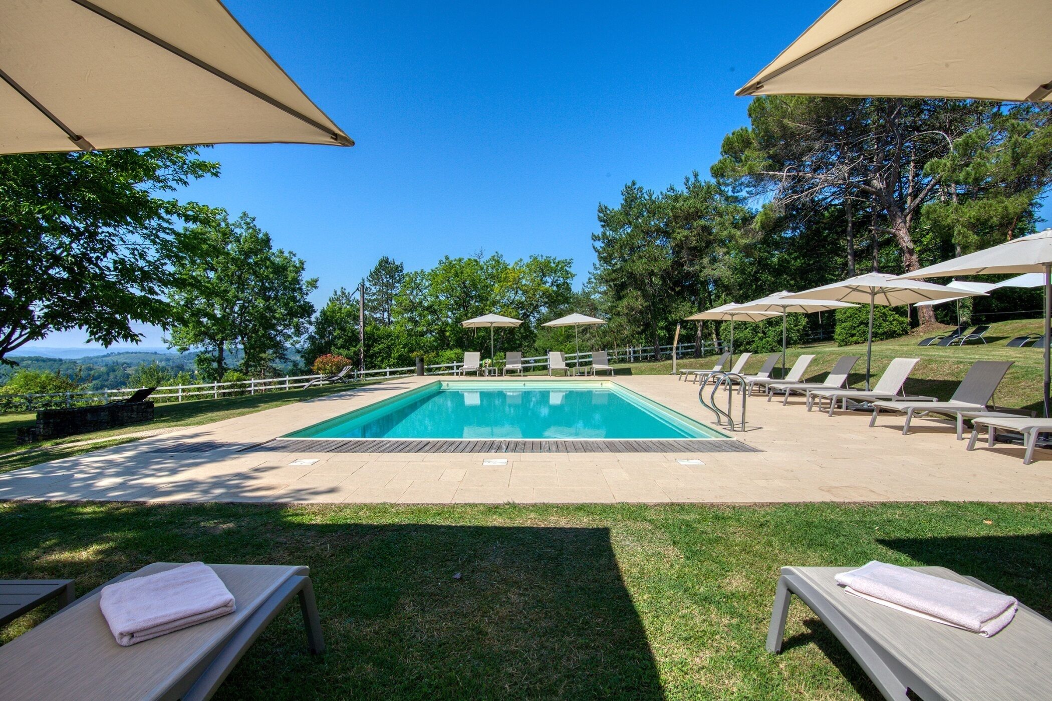 outdoor pool, open 8:00 am to 8:00 pm, pool umbrellas, pool loungers