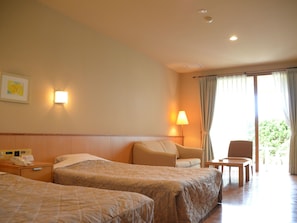 Chambre Standard avec lits jumeaux | Coffre-fort, accès au Wi-Fi (inclus)