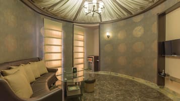Superior Suite, Jetted Tub | Living room | Flat-screen TV