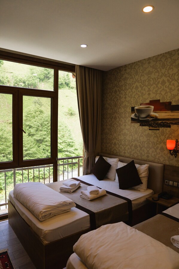 Chambre Deluxe | Chambres insonorisées, Wi-Fi gratuit, draps fournis