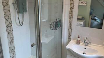 Shower, hair dryer, bathrobes, towels