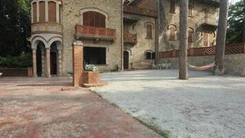 Experience the charm of this historic building with its traditional architecture and beautiful courtyard surrounded by mature trees.