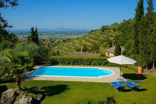 Villa in a hilly area surrounded by greenery with swimming pool and breathtaking views