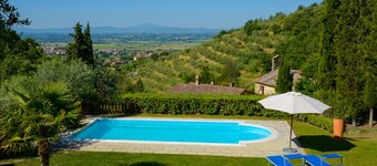 Villa in a hilly area surrounded by greenery with swimming pool and breathtaking views