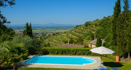 Villa in a hilly area surrounded by greenery with swimming pool and breathtaking views