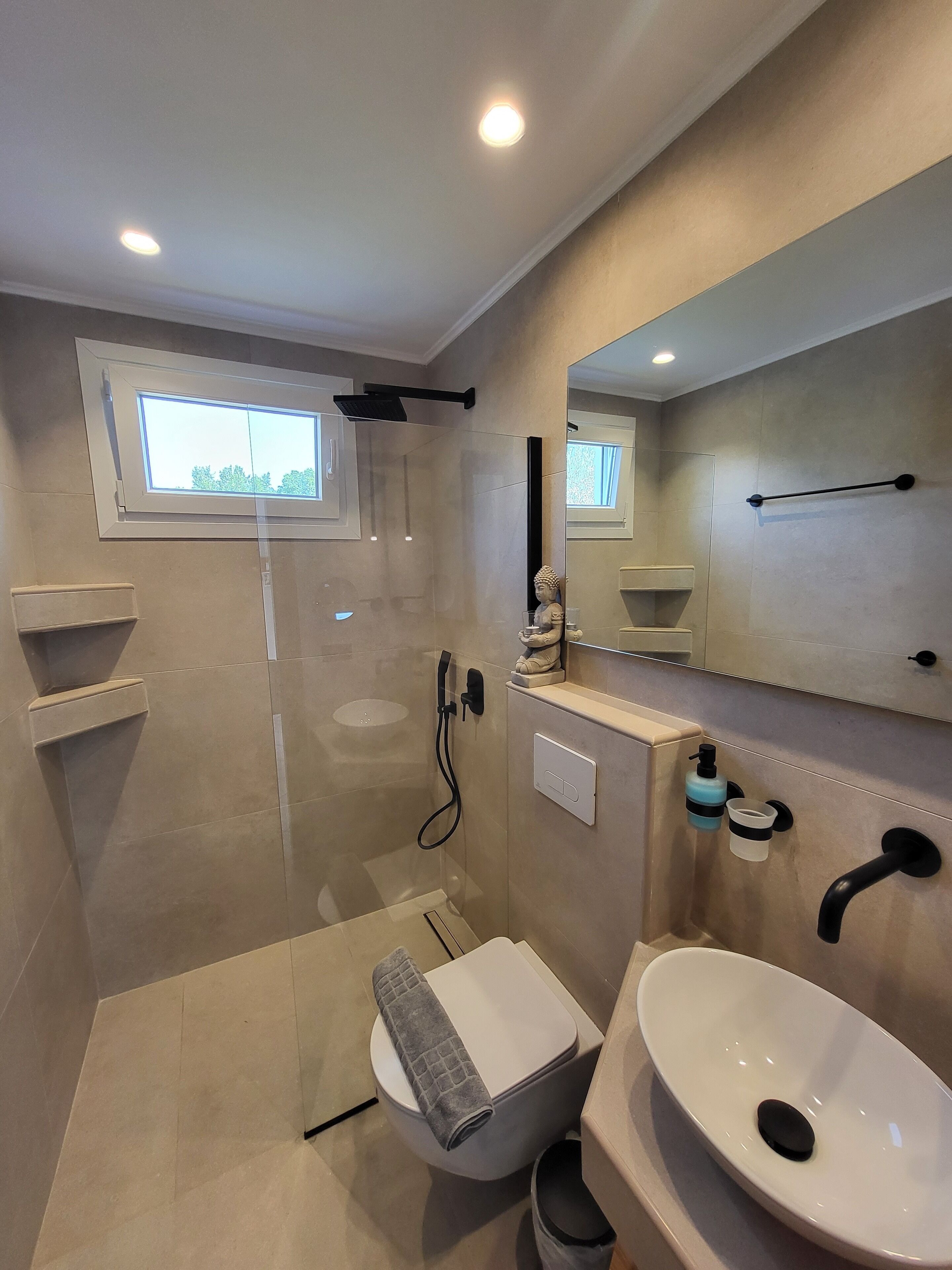Shower, hair dryer, towels, toilet paper