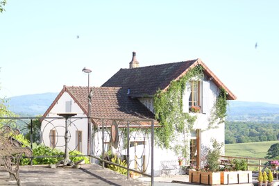 Stylish living in the village square with a large terrace overlooking the Morvan