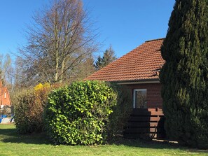Stroll through the beautifully manicured lawn to the front door of this charming single-family home.