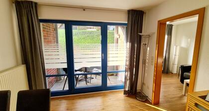 Near the beach, modern ground floor apartment with balcony, free Wi-Fi