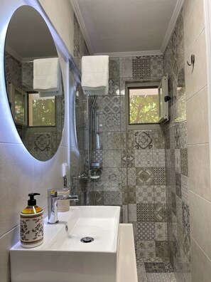 Shower, hair dryer, towels, soap