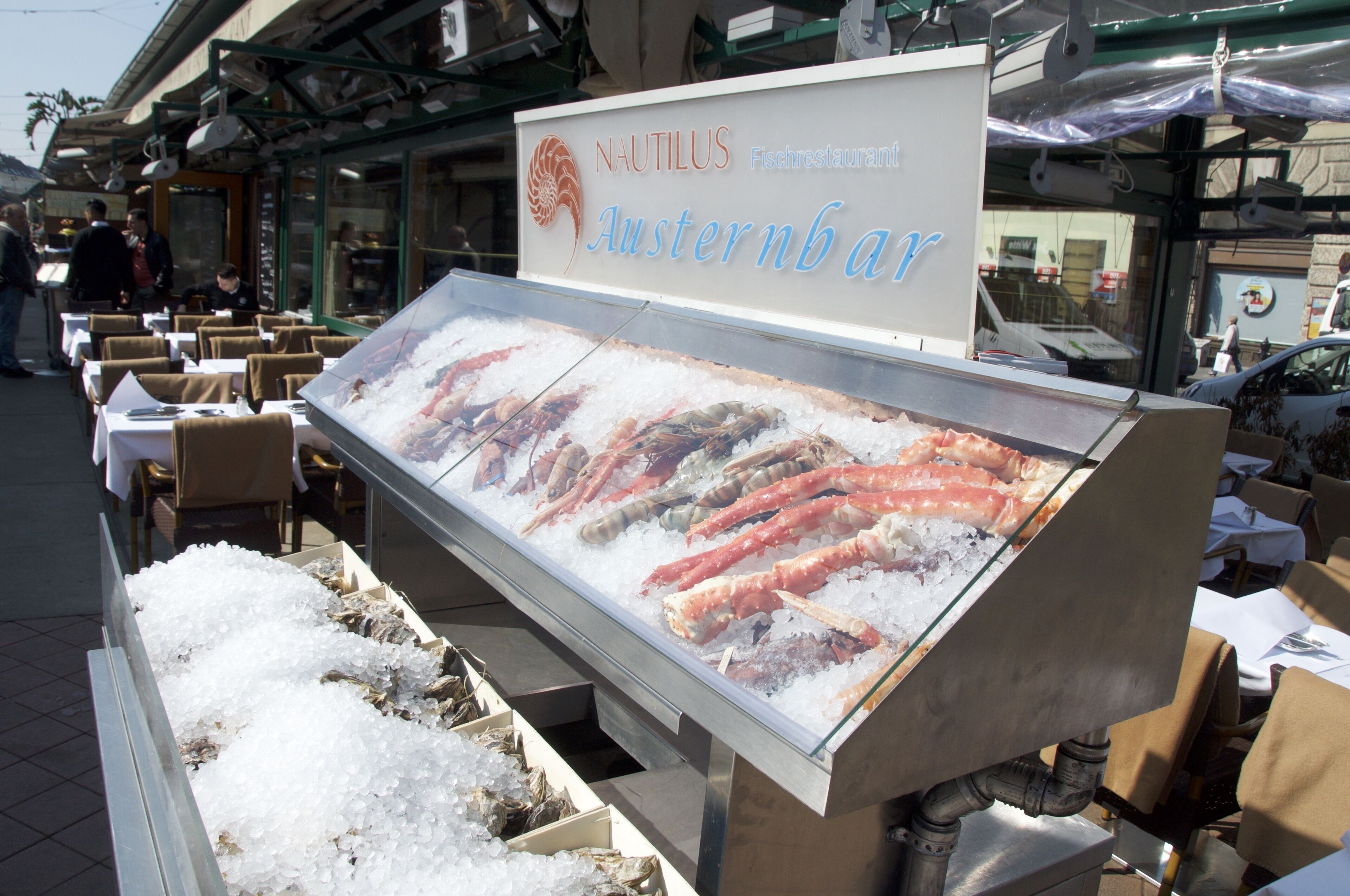 A seafood display at Nautilus Fischrestaurant featuring various types of seafood on ice.