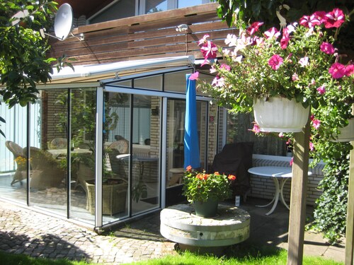 large apartment near the North Sea with conservatory, fireplace, sauna