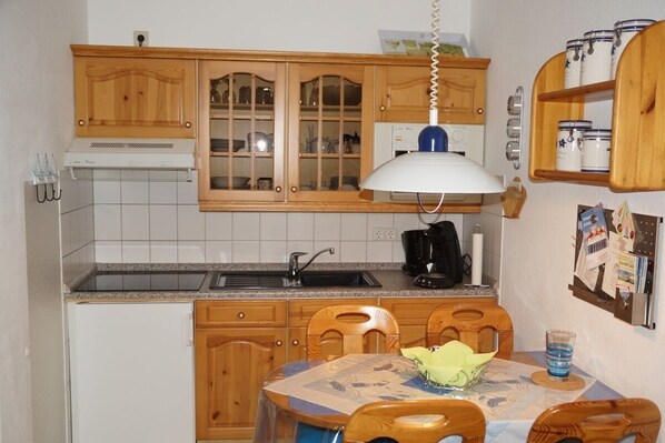 Fridge, microwave, stovetop, coffee/tea maker